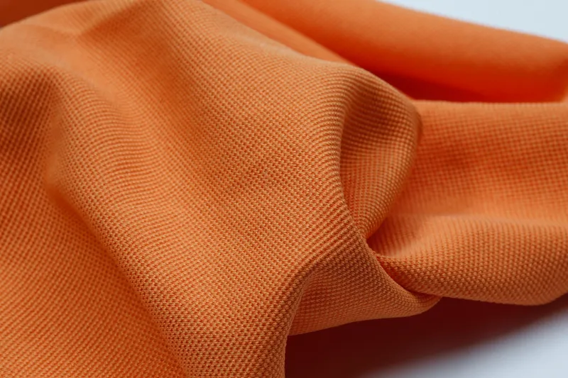 Fabric made from cotton-like fancy yarns with a soft, voluminous structure for textile surfaces with a natural, cotton-like appearance.